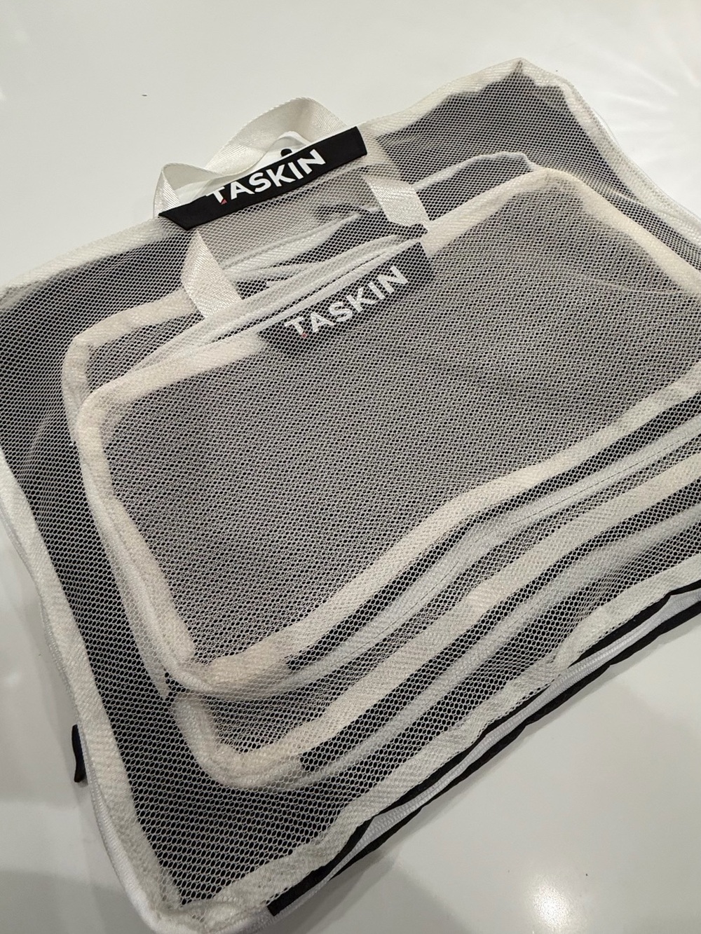 Skin mesh organizer bags in black and white